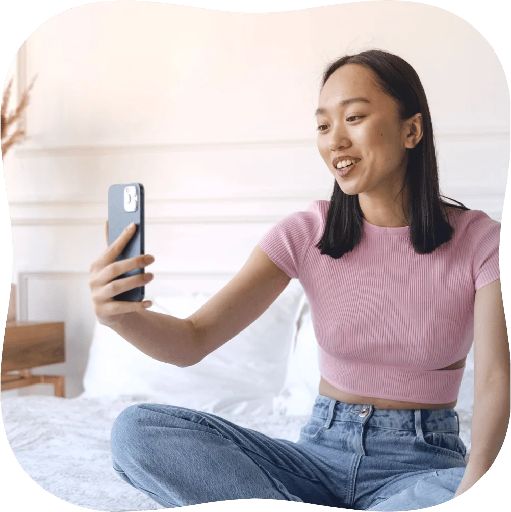 Patient holding up phone in a video call